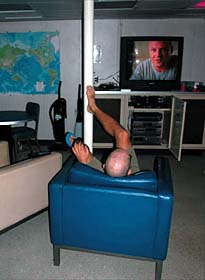 Scientist Dave Shuster kicks back in the video lounge after a long day cleaning corals and compiling data. This room gets increasingly crowded as the hour grows late. 