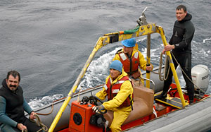 Returning to the ship after the Alvin recovery are, from left, Jerry Graham, Kevin Threadgold, Sean McPeak, and Mark Spear.
