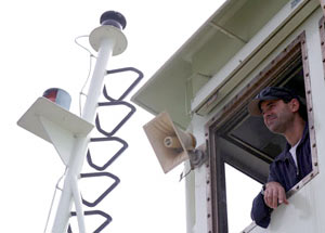 Alvin pilot Bruce Strictrott monitors the sub&rsquo;s recovery from the &ldquo;doghouse,&rdquo; a small room overlooking the fantail that is used by members of the Alvin group. 