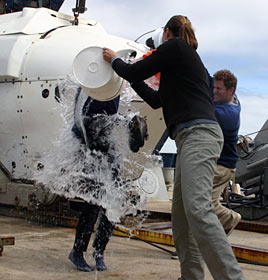 On her return to Atlantis, Brooke Love was greeted by the traditional welcome for a returning first diver in Alvin: a shower of icy seawater, delivered by fellow graduate student Ben Larson and microbiologist Sheryl Bolton, all of the University of Washington. 