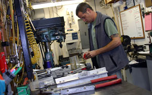 In the ship&rsquo;s mechanical shop, Gavin Eppard prepares tools he will use Thursday during an Alvin dive to the Main Endeavour hydrothermal vent field. Gavin is a mechanical technician and an Alvin pilot in training. 