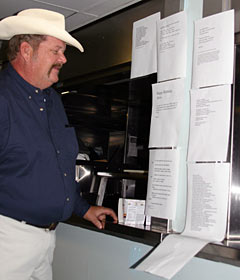 Bosun Wayne Bailey, one of the hosts of the Bos&rsquo;un&rsquo;s Poetry Night, reads poetry entries submitted by students in honor of Alvin&rsquo;s 40th birthday, June 5. The poems were posted in the galley after dinner.