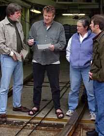 Before the second Alvin dive to the Nootka transform fault, Co-Chief Scientist John Delaney (left), Marine Geolgist Kevin Brown, Chief Scientist Deb Kelley and Oceanographer Mitch Elend discuss plans to identify a cold seep on the seafloor to be used for testing ocean instruments.