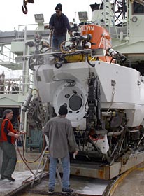 Members of the Alvin group suds the sub, a regular routine after seafloor expeditions. Without a wash and rinse, Electrical Technician George Meier said that bacteria accumulate, giving off a foul smell. 