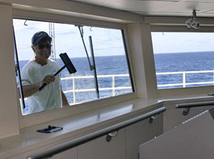Seaman Robert Arthur makes sure the captain and mates have clear views from the ship&rsquo;s bridge. 