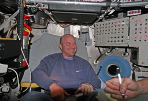 Biologist Tim Shank settles into Alvin for the first dive of the expedition. Space is tight inside the 6-foot (2-meter) sphere. 