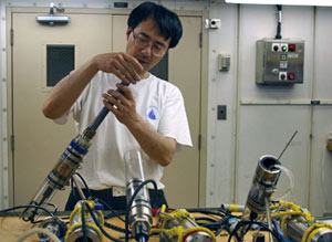 Chemist Kang Ding assembles and calibrates sensors before placing them at Rosebud to monitor temperatures and fluid chemistry at the vents. The sensors will remain at the site 13 days, until the end of the expedition. 
