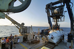 Alvin�s return to the ship each evening always draws a crowd. For safety reasons, people are asked during the sub�s recovery to stay behind the yellow line painted on the deck.
