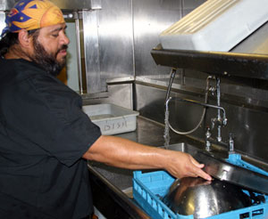Ricky Rios, originally from Kingsville, Texas has been cooking on ocean research vessels for more than 20 years. On our cruise he works as a mess attendant, responsible for dishwashing, restocking the galley&rsquo;s refrigerator and freezer, and cutting fruits and salads served at meals. (Photo by Amy Nevala)