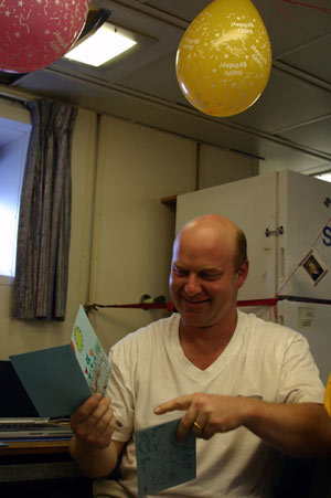 Biologist Tim Shank, the chief scientist on our expedition, celebrates his 40th birthday today by reading cards made by his daughters Emma, 5, and Callie, 3. Before the expedition, Tim’s colleagues brought him the cards from Cape Cod in Massachusetts.