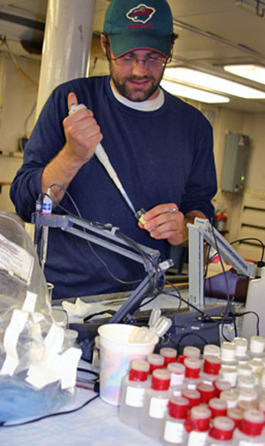 Chemist Nick Pester titrates water collected from Rosebud to learn how the chemistry of fluids seeping from hydrothermal vents differs from seawater. (Photo by Amy Nevala)