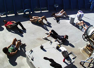 Members of the science party and Alvin crew take a break by doing aerobics on the bow. 