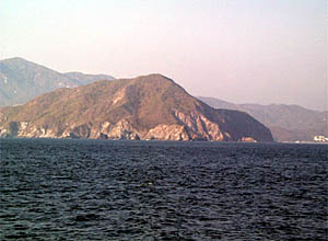 R/V Atlantis sails past the white sand beaches and rugged coastline of Mexico just north of Manzanillo. 