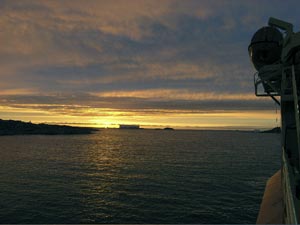 Palmer Station enjoys long beautiful sunsets in the fall, such as this one, seen from the Gould. (Photo by L. Von Harbou)