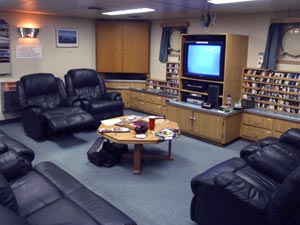 Roughing it near the Antarctic Circle, the ship�s lounge is outfitted with computers, books, DVDs, large-screen TVs, and really comfortable seating! (Photo by B. Pedler, WHOI)