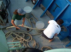 Katie Wilson and Ed Popowitz haul in the lines after they are cast off from the dock. 