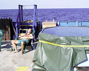 Paul Vinitsky relaxes by the pool while he is off watch. 