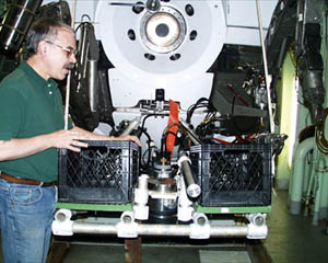 Jim Cochran checking the equipment installed in Alvin’s basket this morning before Dive 3524. 