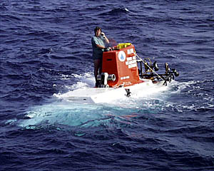 Pat Hickey talks on the phone to the pilot as Alvin is prepared for recovery. 