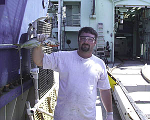 Ed Popowitz shows off his catch, a mahi mahi. 