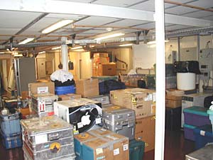 The computers scientists use to process data collected during a cruise must be brought in boxes from their labs to the ship. Here in the ship’s main science lab, they are unpacked, set up and tied down to stay in place on the high seas.