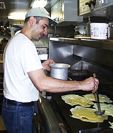 George Pimentel making cheese omelets this morning. He and Dan Engelbrecht, the head cook, keep us well fed and looking forward to every meal.