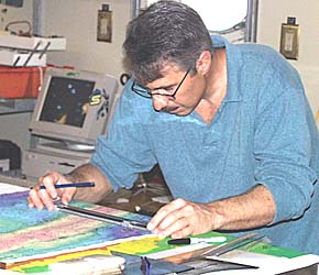 Dan Fornari checks the latitudes and longitudes of the beginning and end points for the DSL-120 sonar survey. He has to be sure to plot the points carefully so that we survey the right area of seafloor. 