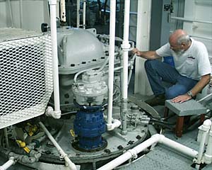 Chief Engineer Ron Wheatley checks the stern “Z-drives” on R/V Melville. “Z-drives” provide the main propulsion for the ship. There are two stern Z drives on the R/V Melville. 