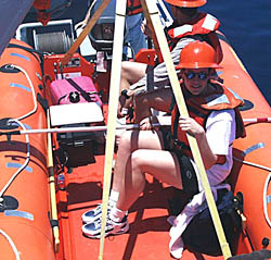 Julia Getsiv is going for a boat ride with Capt. Eric Buck to test the rescue boat. Here you see the boat being launched off the 02 level port side of R/V Melville.