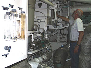 We are surrounded by the water of the Pacific Ocean, but we can’t drink seawater! We have to make all the drinking water we need. Here, Ron Wheatley checks the status of the equipment that makes fresh water -- the evaporator and the reverse osmosis system.