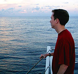 Peter Lean is enjoying the beautiful sunset from the bow of the ship. Watching sunsets is a favorite past time at sea, with everyone looking to see if they can catch a glimpse of the “green flash” as the sun sinks down over the horizon.