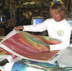 Uta Peckman has just produced another multibeam bathymetry map and added to it the DSL-120 sonar track we just completed. This type of map is useful because it shows the exact path the sonar fish took over the ocean floor. The sonar record and the fish track are recorded with times. When we see an interesting feature on the sonar record, we find the same time on the fish track to see exactly where it is located on the map. By matching these positions, we can drive Argo II back to the exact spot to take pictures of the seafloor features imaged acoustically by the DSL-120 sonar. Computer programs used on the ship give us the ability to plot many different types of data on the bathymetric maps, such as the locations of the transponders, locations of earthquakes, and the locations of the samples we collect. Each piece of data has a position (like an address for a house on a street) associated with it. Using the position, we can plot different data on the maps to see how things relate to each other. Making seafloor maps is an important part of what a marine geologist does.