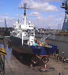 A view of R/V Melville’s port quarter when she was in drydock. Note the port and starboard thrusters mounted side by side. These are the main way in which the ship is propelled. The stern boards and stern A-frame have been removed to expose the stern ramp for cleaning and painting. The stern ramp is similar to ramps found on trawlers, and could be used for hauling nets in fisheries research. On R/V Melville, it is not used very often, so most of the time it is boarded over to provide additional deck space.