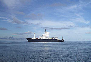 R/V Melville holds position while we complete the sampling program near 1° 40’N. Dave Murline, the First Mate, and Capt. Buck took one of the small boats for a spin to test the engine. Rachel Haymon went along and took this picture.
