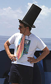 Dan Scheirer prepares his cases as the Royal Public Defender. He is wearing a tie made from a multibeam bathymetry map, and, as a sign of his professional abilities, has a shark toy hanging from his shirt.