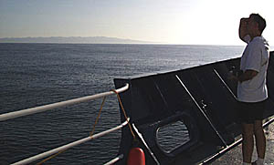 Mike Perfit scans the horizon as Santa Cruz Island comes into view. 