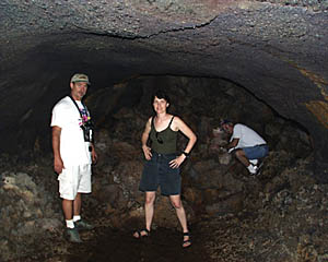 Dave Murline (left), Maya Tolstoy, and Mike Perfit in one of the blocked-off chambers of a lava tube we visited today on Santa Cruz Island. Imagine this tube filled with flowing hot lava! The walk through the tube was about 1 kilometer long, but the local people say that the tube starts near the top of the volcano and continues for many kilometers all the way to the coastline. How can lava travel so far without becoming cooling down and becoming solid? The tube insulates the lava -- just like the Thermos bottles or insulated cups that people use to keep their coffee hot.
