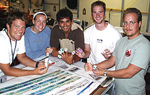 Some of the students holding their styrofoam cups that were sent to the bottom of the ocean on the dredge wire this morning. Compare the size of these cups with the pictures of them in yesterday’s slide show! From left: Ben Wigham, Julia Getsiv, Jon Burgess, Tim Head, Erin Todd.