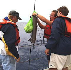 One of the most “important” jobs is hanging the bag of styrofoam shrink cups next to the pinger. The decorated styrofoam cups that the students have been making will get squished by the pressure at depth. 