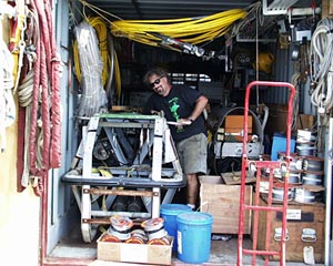 PJ Bernard of the WHOI Deep Submergence Operations Group is all smiles as he ties Argo II down in the shipping van. The rest of the van will be packed with boxes of equipment and shipped back to Woods Hole Oceanographic Institution (WHOI).