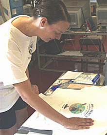 Julia Getsiv makes cruise T-shirts in the Main Lab this afternoon. It is a tradition on oceanographic cruises is to make a T-shirt as a souvenir of the expedition.