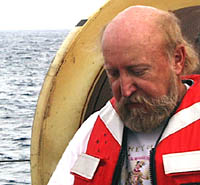 Ron Comer geared up in a working life vest ready to lower the DSL-120 sonar fish over the side.