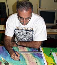 Mike Perfit checking navigation points for the DSL-120 sonar survey lines on the crest of the East Pacific Rise in the Main Lab of R/V Melville.