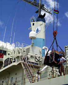 The ship’s supplies arrive at last. A crane comes in handy for lifting the heaviest containers.  
