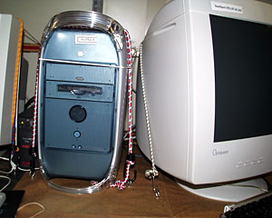 A secured computer is a safe computer. Bungee cords keep equipment on the bench - and off tender toes.  