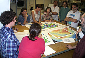 During the transit to the first research site, scientists discuss their surveying and sampling strategies.  