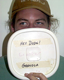 Graduate student Robbie Young samples the homemade granola prepared by one cool dude, Knorr cook Chris Poulin.  