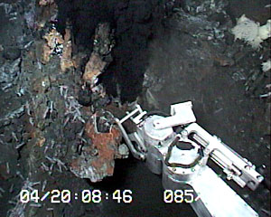  ROV Jason samples a piece of a black smoker chimney then lifts it on to the basket.