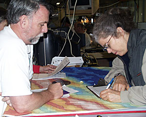 Chemists Eric Olson and Charlotte Meredith plot the CTD position during today’s tow-yo.  