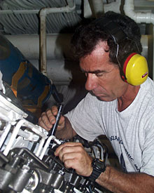 First Assistant Engineer Wayne Sylvia checks the valves in the ship’s injectors. Keeping all the equipment on the ship in good shape is a full time job for the Engineering Department on Knorr.   